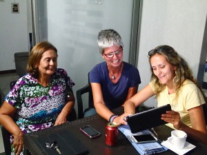Amira, Feli and Andrea busy with Google Translate